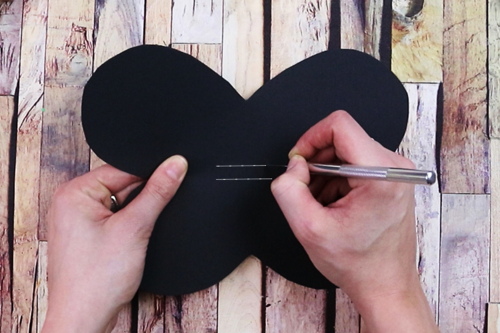 Marionnette papillon avec une cuillère en bois
